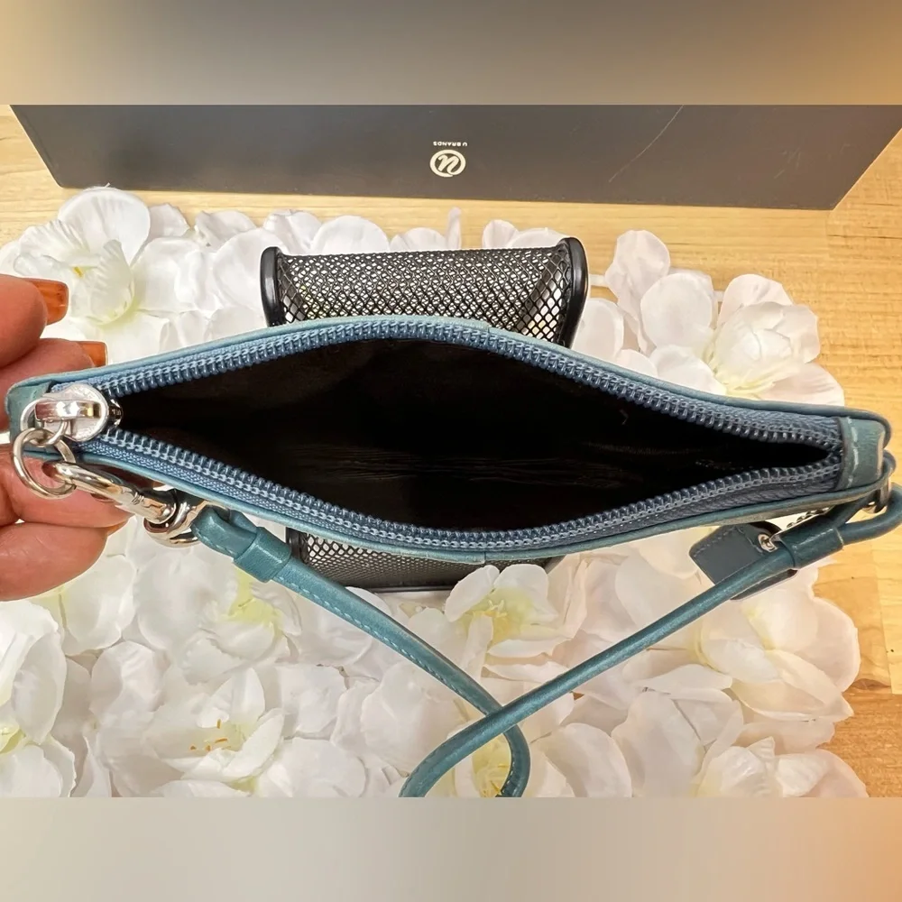Coach Legacy Leather Small Wristlet. design is featured during Coach’s 65th